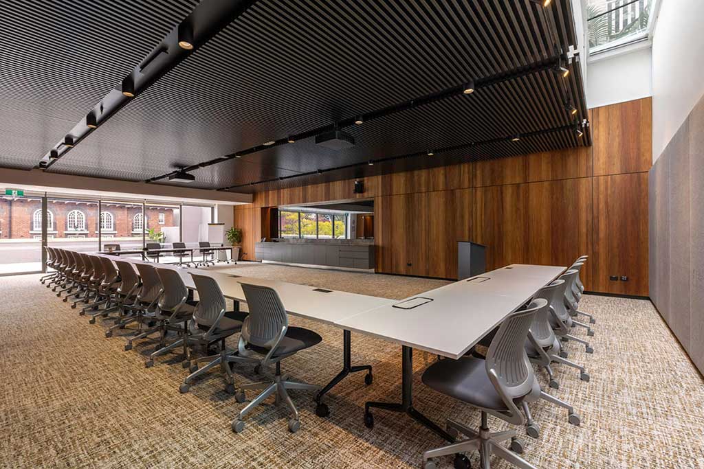 This is the level 2 lecture room setup in a U shape. There are 24 chairs around the table, with external access and views to Kirribilli Ave on the top left hand side.