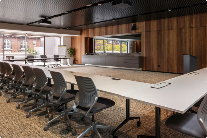 Conference Room - lecture room with tables and chairs organised in a u-shape.